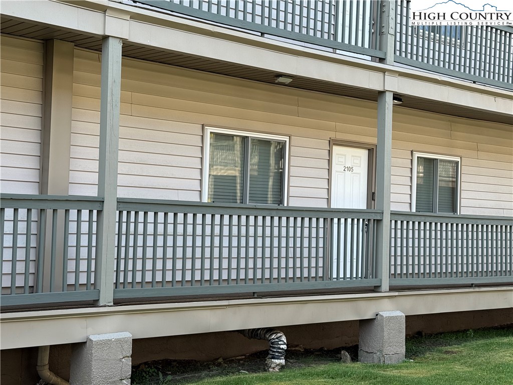301 Pinnacle Inn Road, Unit 2105 Beech Mountain, NC 28604 - Photo 2 of 23 a porch with a chair