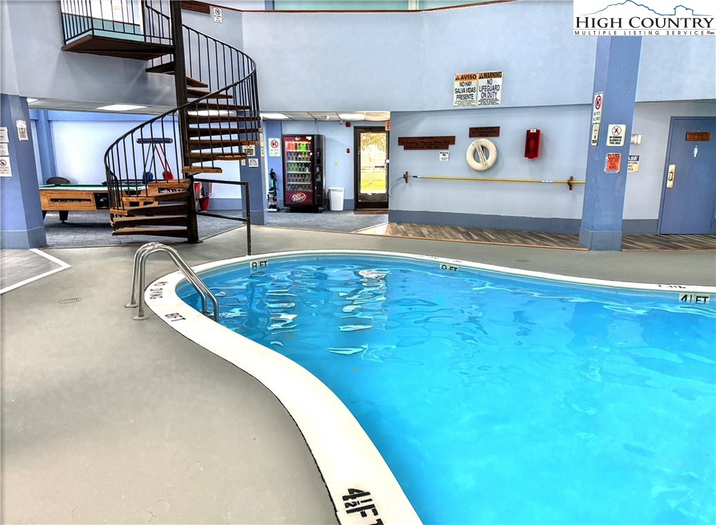 301 Pinnacle Inn Road, Unit 2105 Beech Mountain, NC 28604 - Photo 21 of 23 a view of a swimming pool with seating space
