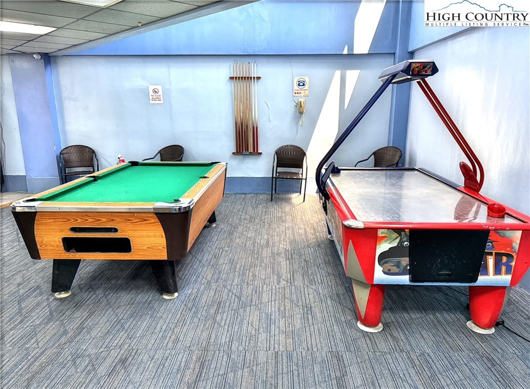 301 Pinnacle Inn Road, Unit 2105 Beech Mountain, NC 28604 - Photo 22 of 23 a room with wooden floor pool table and windows