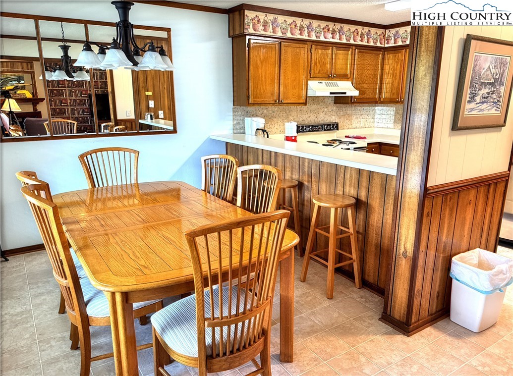 301 Pinnacle Inn Road, Unit 2105 Beech Mountain, NC 28604 - Photo 6 of 23 a view of a dining room with furniture and window