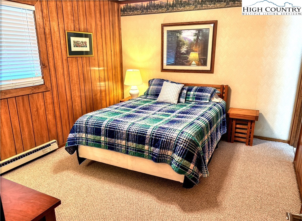301 Pinnacle Inn Road, Unit 2105 Beech Mountain, NC 28604 - Photo 9 of 23 a bedroom with a bed and a window