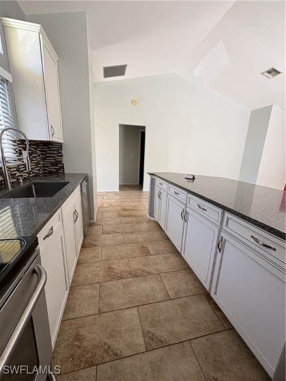 5560 Longleaf Drive North Fort Myers, FL 33917 - Photo 11 of 40 a kitchen with granite countertop a sink and cabinets
