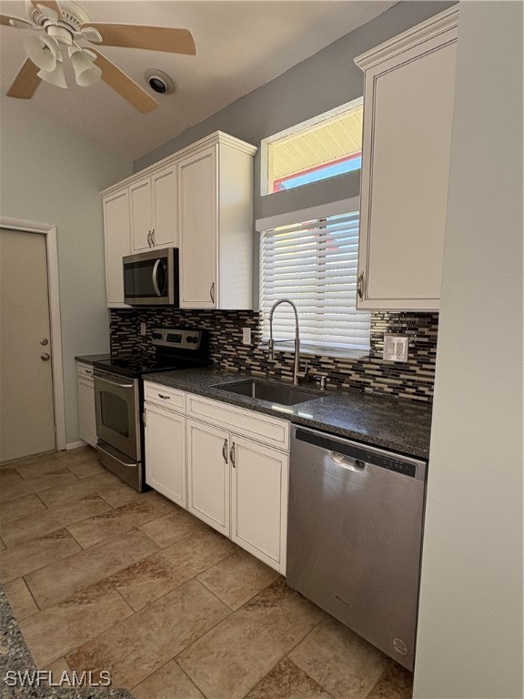 5560 Longleaf Drive North Fort Myers, FL 33917 - Photo 15 of 40 a kitchen with stainless steel appliances granite countertop a sink and a stove