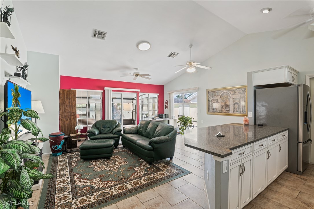 5560 Longleaf Drive North Fort Myers, FL 33917 - Photo 31 of 40 a living room with furniture and a large window