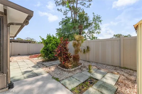 a view of a backyard of the house