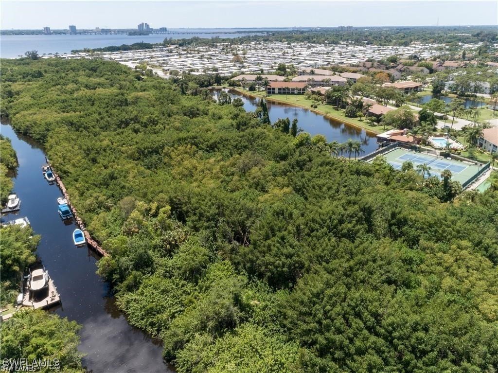 5560 Longleaf Drive North Fort Myers, FL 33917 - Photo 37 of 40 an aerial view of residential houses with outdoor space and trees