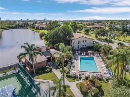 an aerial view of a house with garden space and ocean view