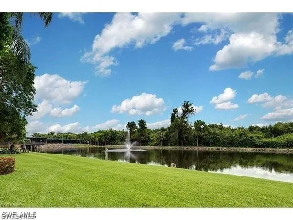 a view of a lake and green space