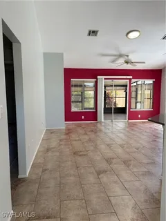a view of a room with window and a fireplace