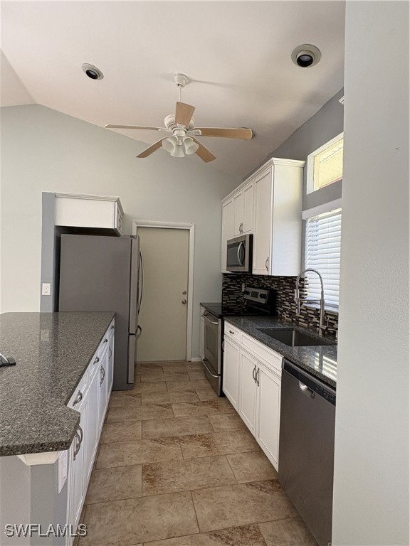 5560 Longleaf Drive North Fort Myers, FL 33917 - Photo 10 of 40 a large kitchen with a stove and a refrigerator