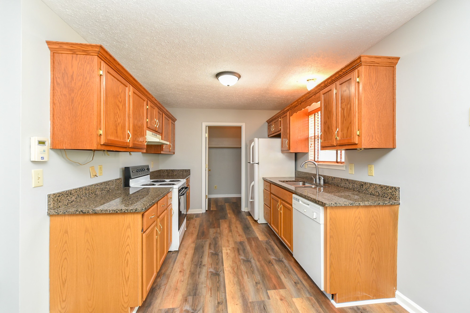 105 Phillip Drive Springfield, TN 37172 - Photo 11 of 24 a kitchen with granite countertop stainless steel appliances a sink a counter top space and cabinets