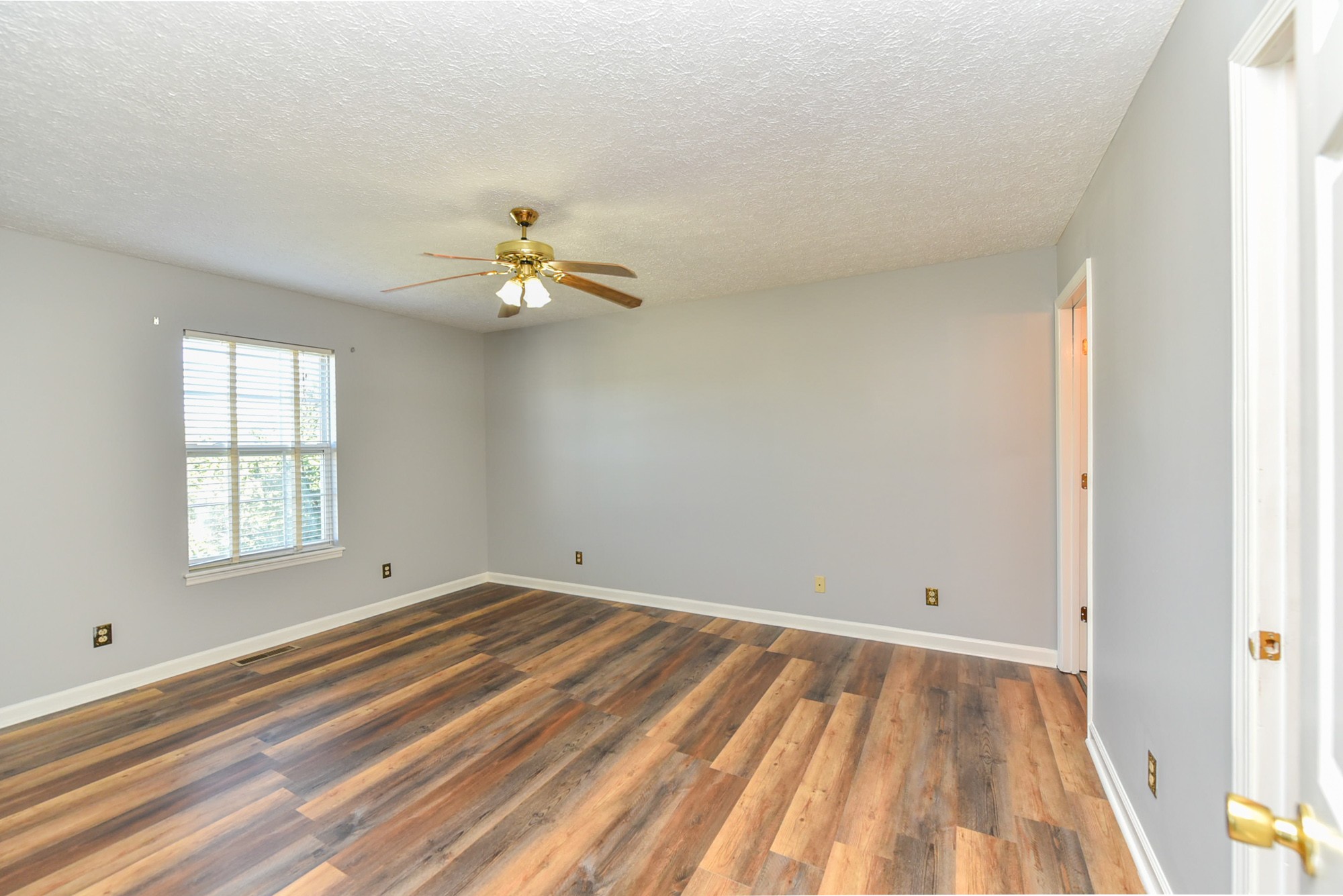 105 Phillip Drive Springfield, TN 37172 - Photo 17 of 24 wooden floor in an empty room with a window