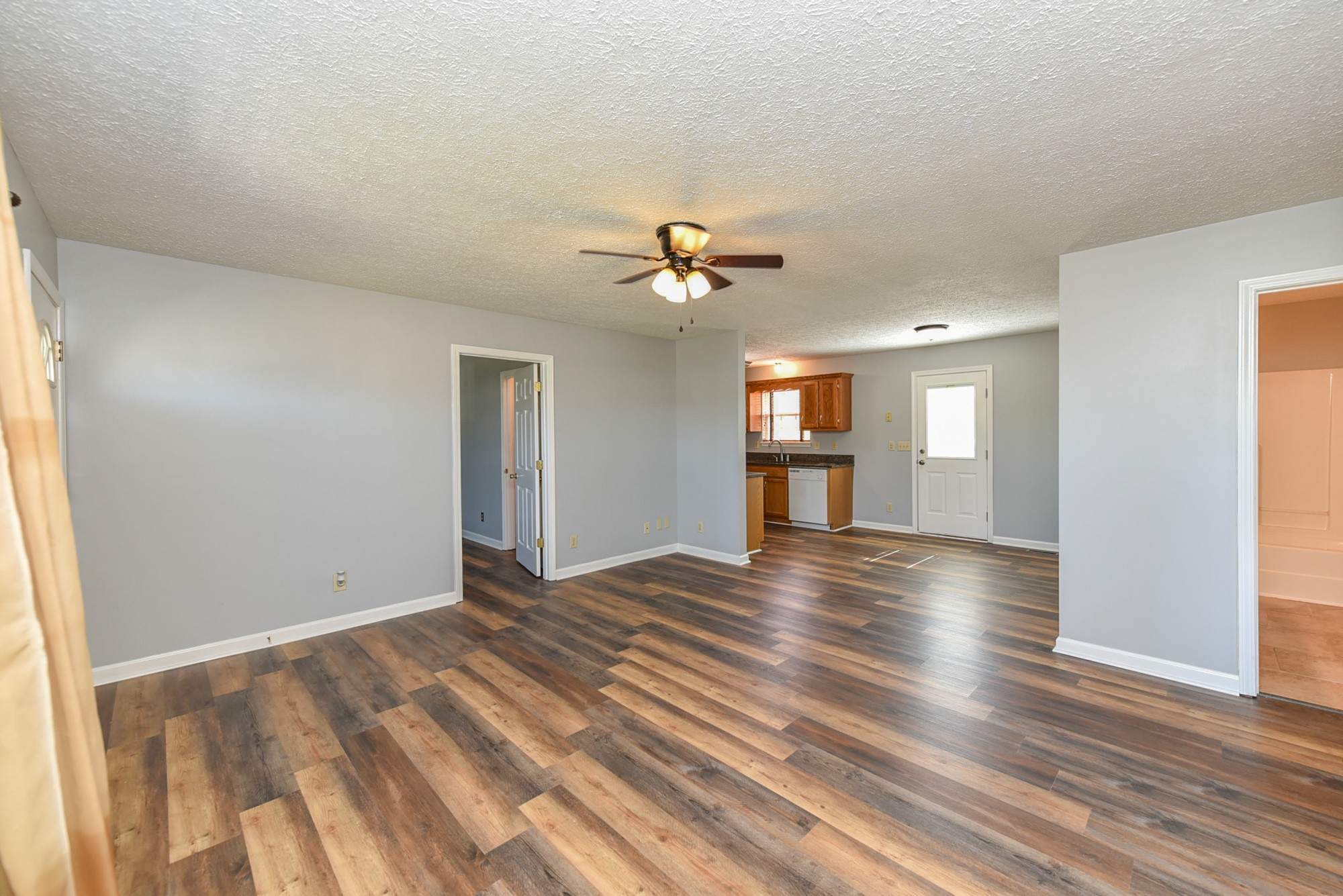 105 Phillip Drive Springfield, TN 37172 - Photo 8 of 24 a view of an empty room with window and wooden floor