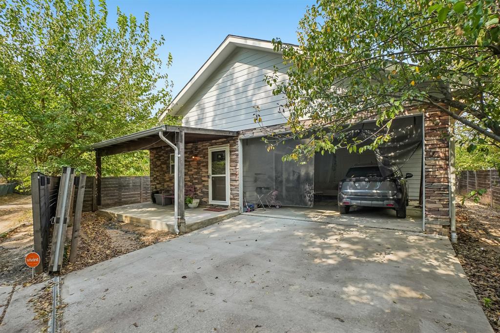 1414 Record Crossing Road Dallas, TX 75235 - Photo 37 of 40 1414B Attached Carport and Driveway