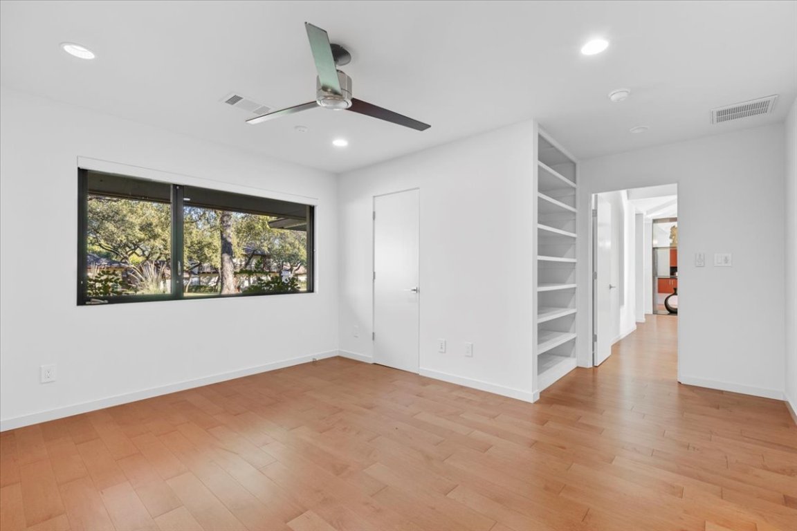 3923 Glengarry Drive Austin, TX 78731 - Photo 20 of 33 wooden floor in an empty room with a window