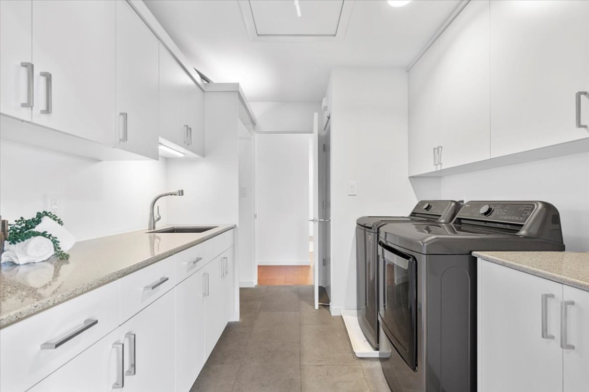 3923 Glengarry Drive Austin, TX 78731 - Photo 26 of 33 a kitchen with a sink stove and cabinets