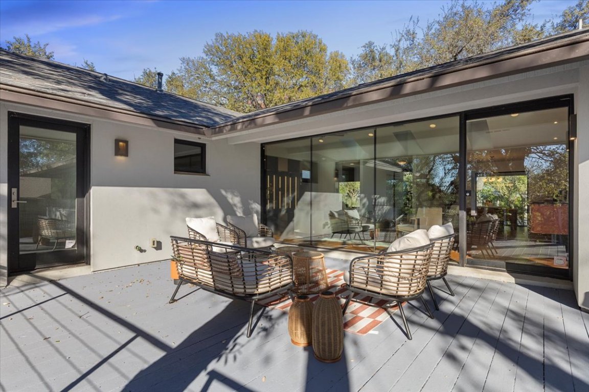 3923 Glengarry Drive Austin, TX 78731 - Photo 29 of 33 a view of a patio with couches table and chairs and potted plants