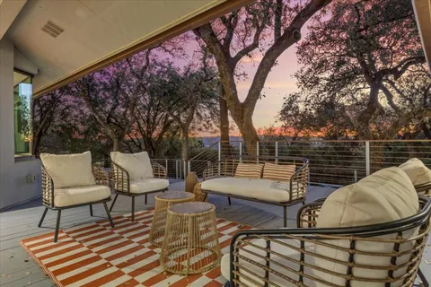 a vase of flowers sitting next to a window