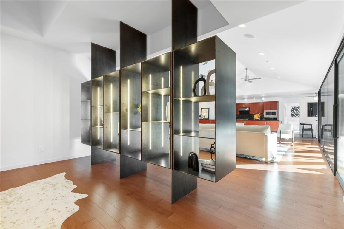 3923 Glengarry Drive Austin, TX 78731 - Photo 8 of 33 a view of a hallway with wooden floor and furniture