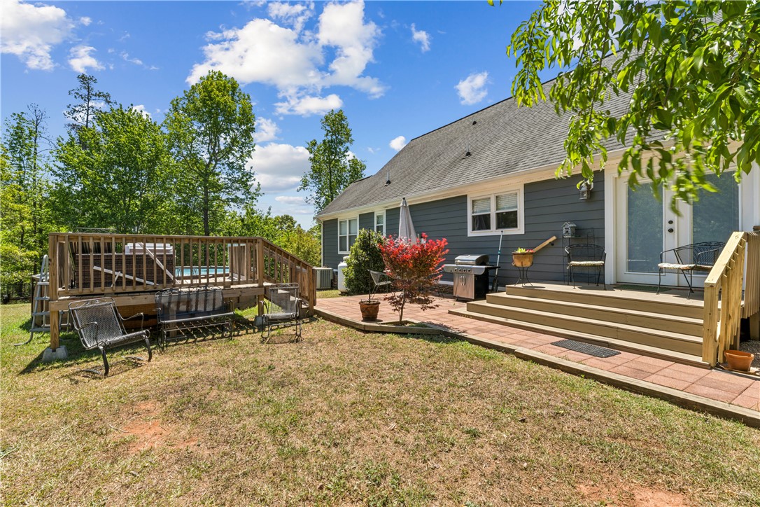 189 Little Choestoea Road Westminster, SC 29693 - Photo 31 of 38 This charming home offers a spacious deck and patio, ideal for outdoor gatherings.