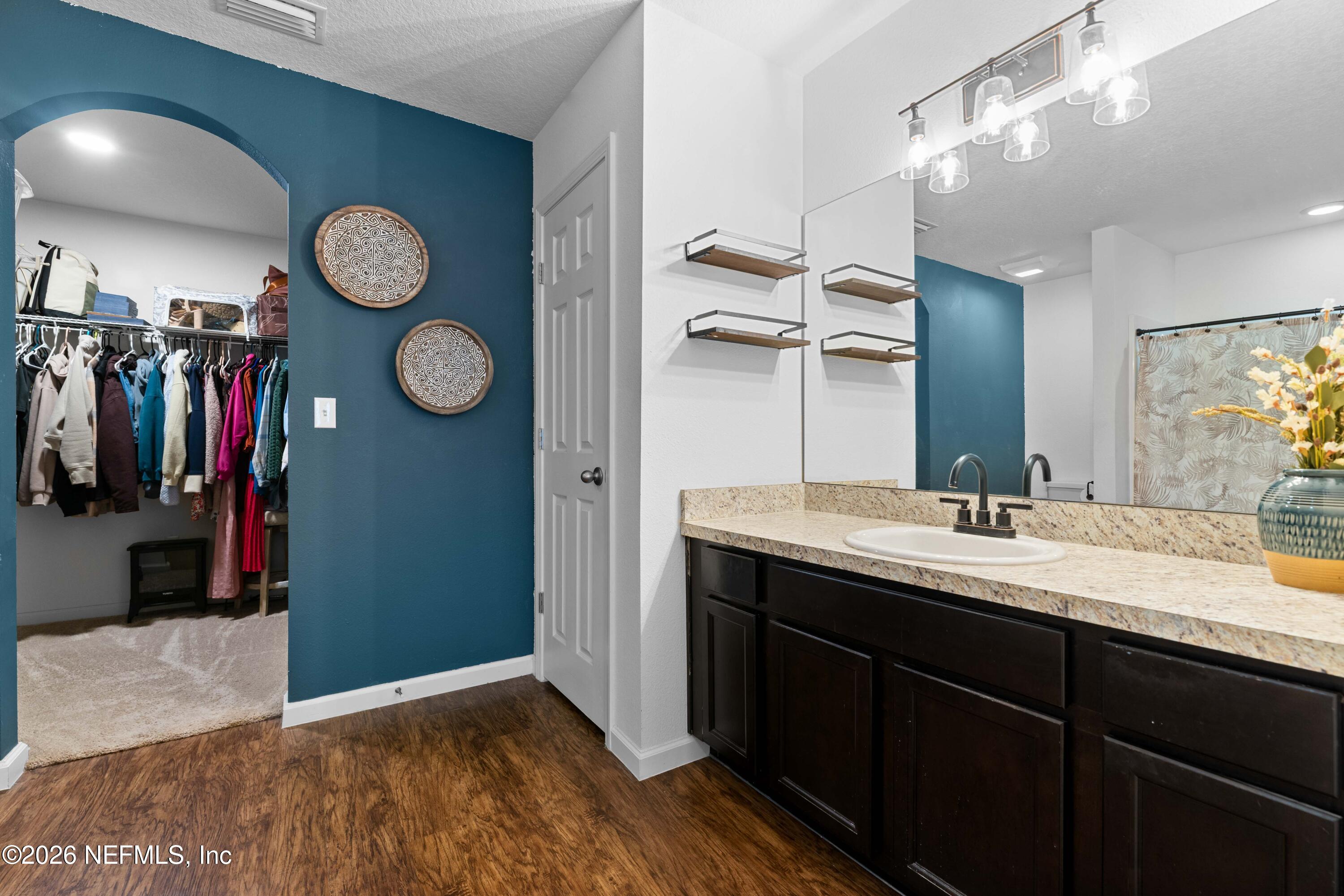 6178 Daylilly Road Macclenny, FL 32063 - Photo 17 of 29 a bathroom with a sink and a mirror