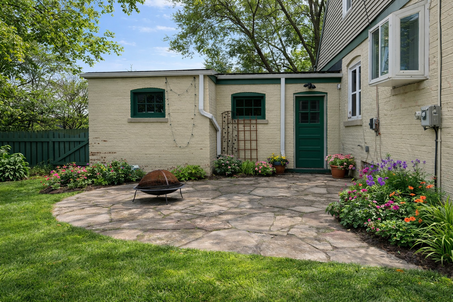 2727 Elgin Road Evanston, IL 60201 - Photo 11 of 11 a front view of a house with garden