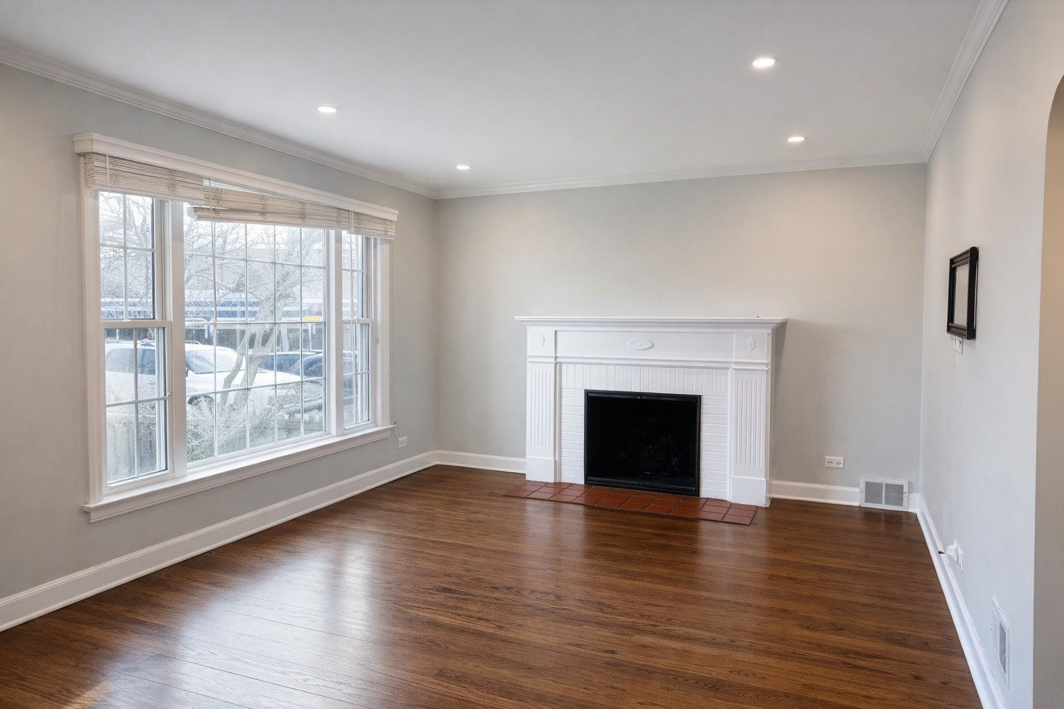 2727 Elgin Road Evanston, IL 60201 - Photo 2 of 11 a view of an empty room with wooden floor and a window