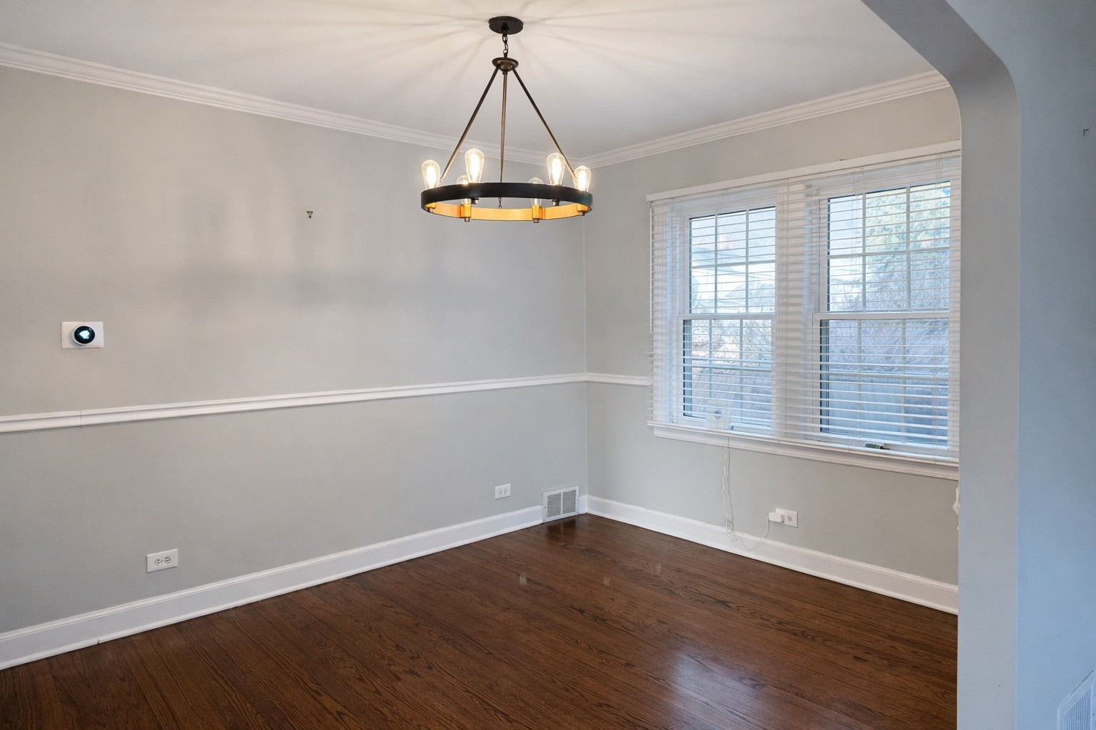 2727 Elgin Road Evanston, IL 60201 - Photo 4 of 11 wooden floor in an empty room with a window