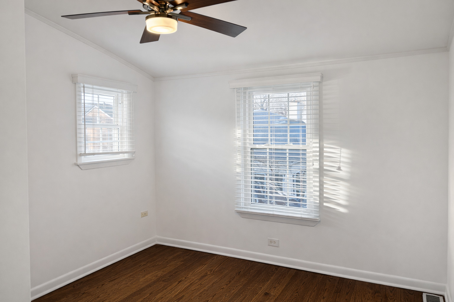 2727 Elgin Road Evanston, IL 60201 - Photo 9 of 11 a view of an empty room with wooden floor and a window