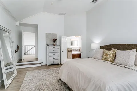 a bedroom with a bed and a cabinets