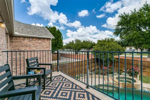 a view of a balcony with wooden fence