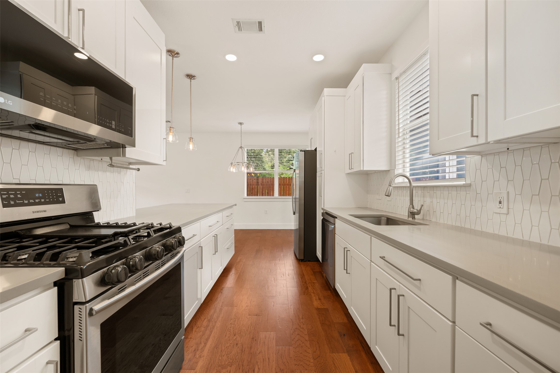 4912 Sara Drive, Unit A Austin, TX 78721 - Photo 13 of 28 Functional kitchen with plenty of prep space and storage.