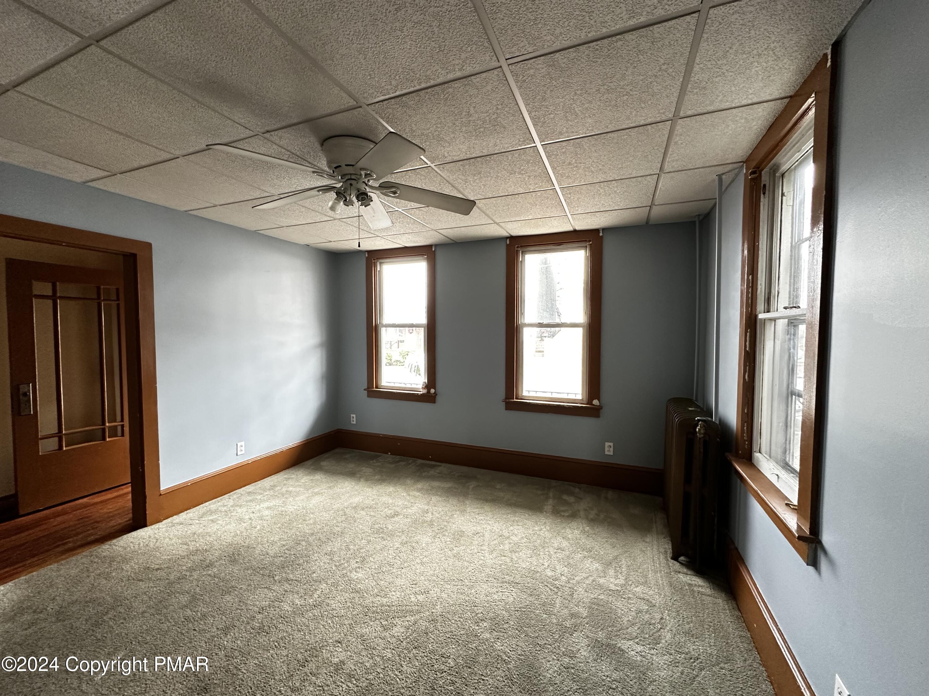 308 South Beech Street Mount Carmel, PA 17851 - Photo 11 of 34 a view of a room with a windows and chandelier