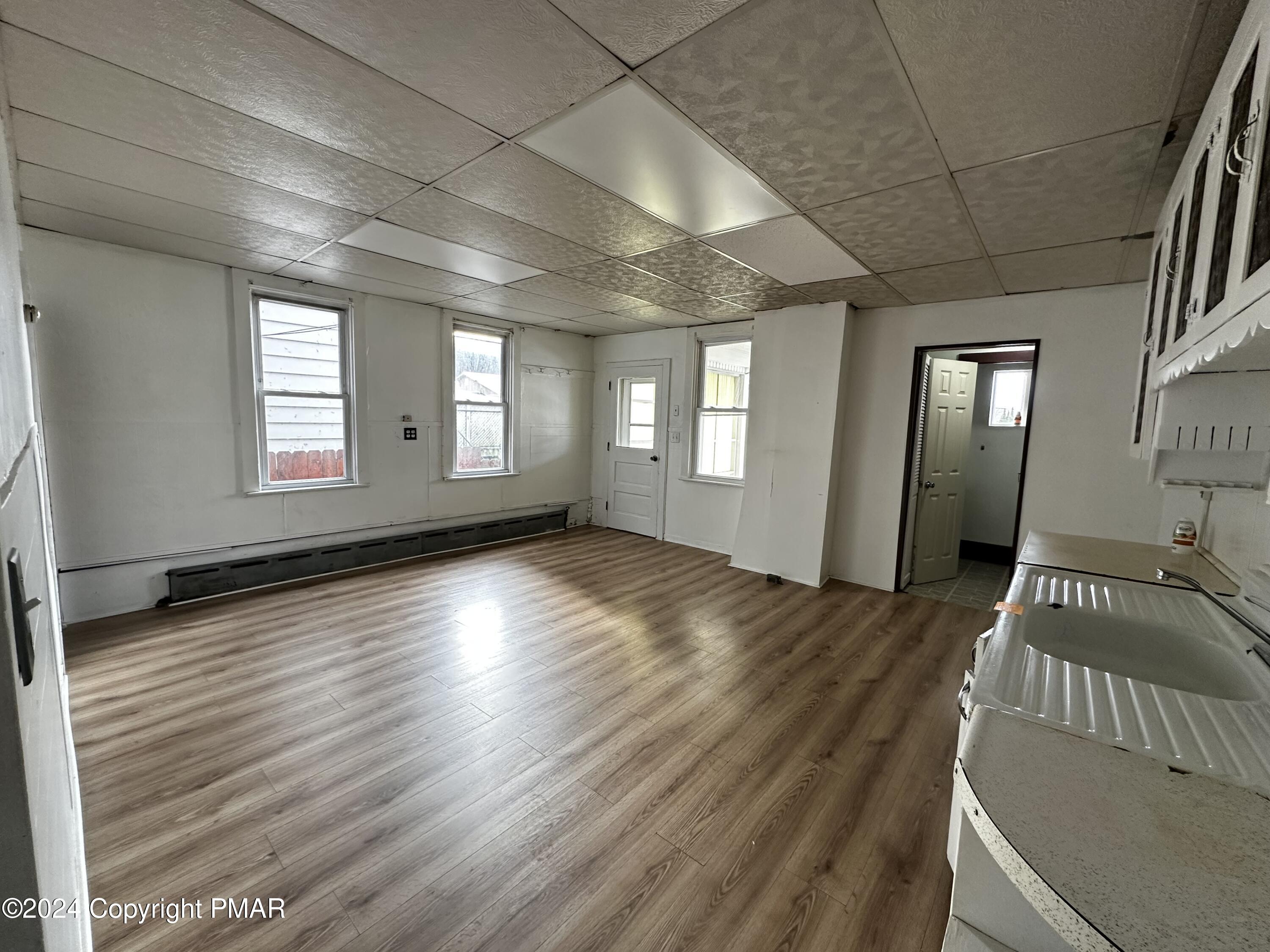 308 South Beech Street Mount Carmel, PA 17851 - Photo 18 of 34 a view of an empty room with wooden floor and a window