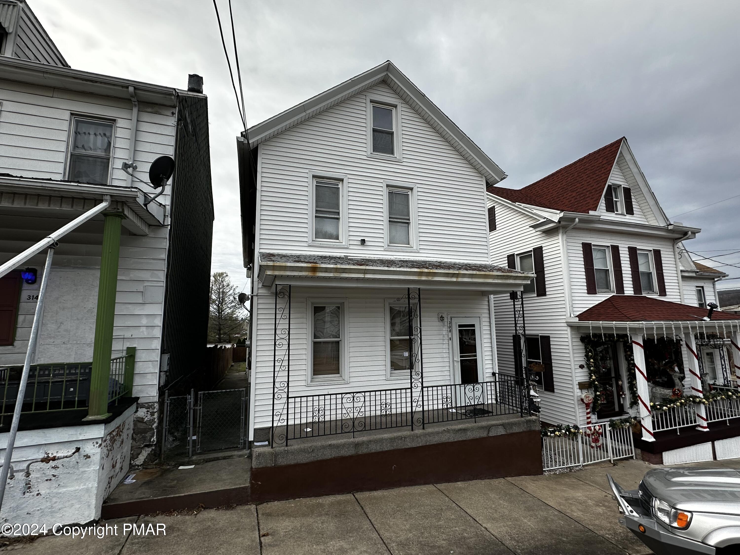 308 South Beech Street Mount Carmel, PA 17851 - Photo 2 of 34 a front view of a house with a porch