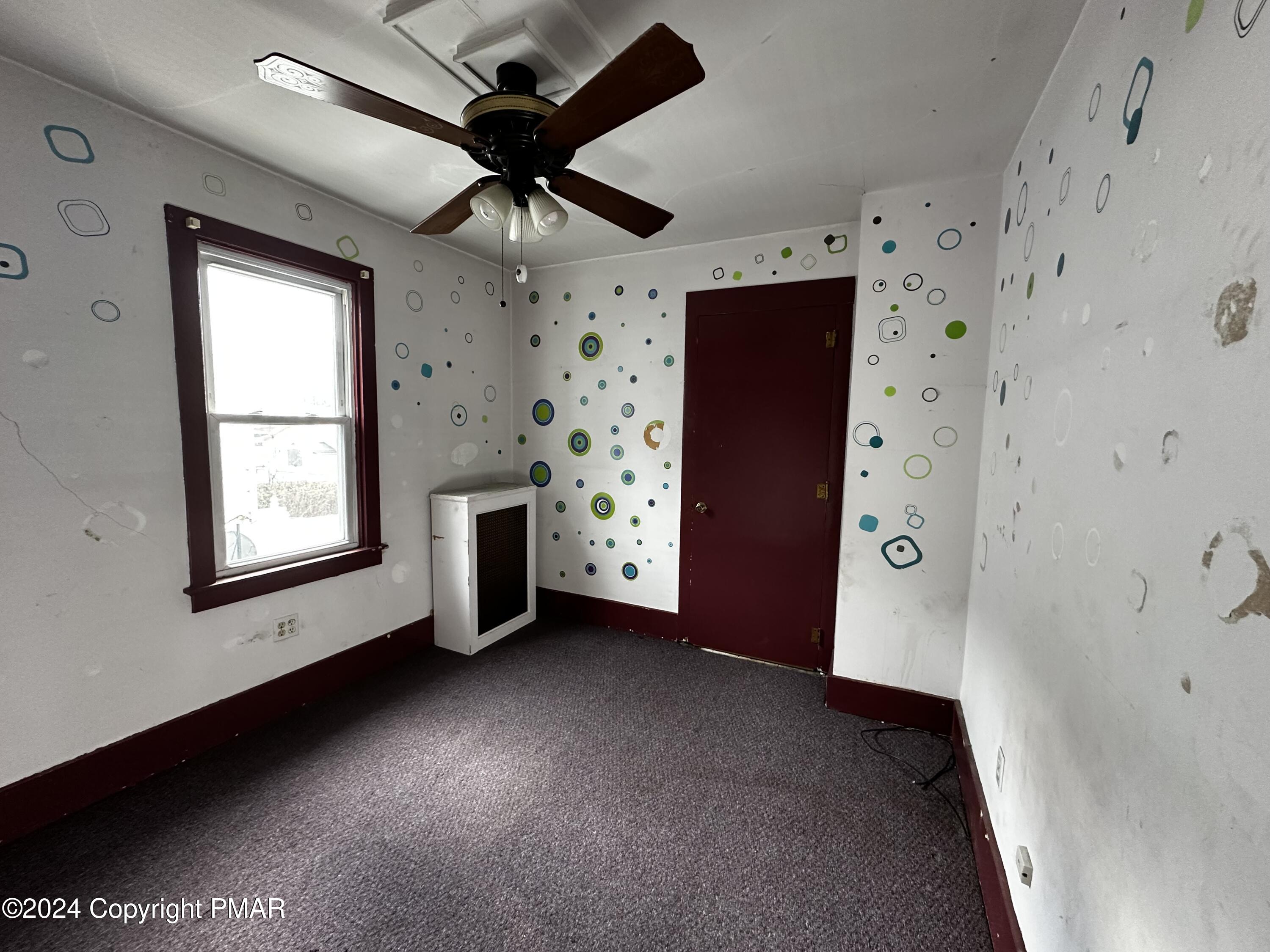 308 South Beech Street Mount Carmel, PA 17851 - Photo 25 of 34 a view of a livingroom with a ceiling fan & window