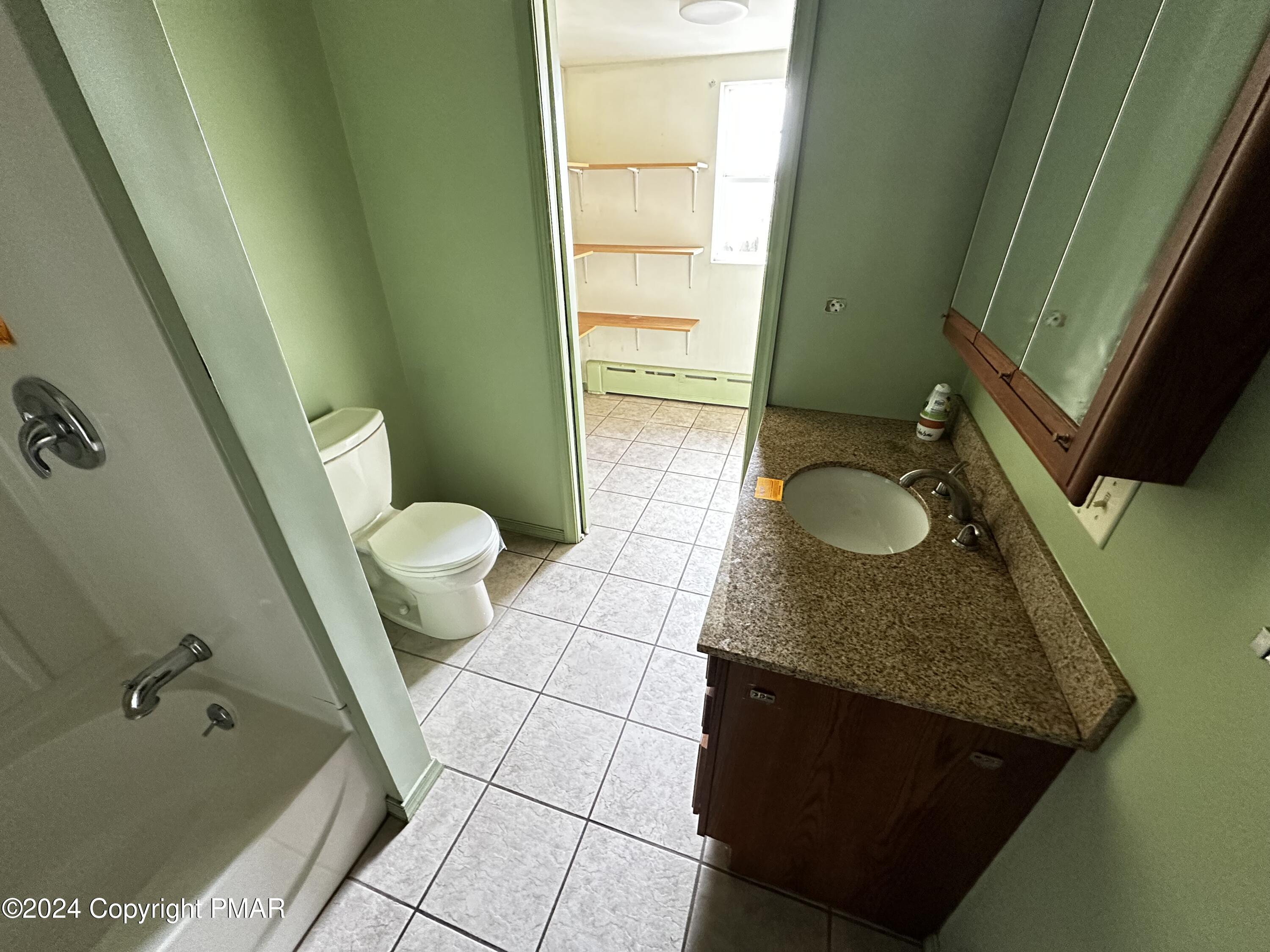 308 South Beech Street Mount Carmel, PA 17851 - Photo 29 of 34 a bathroom with a granite countertop sink and a mirror