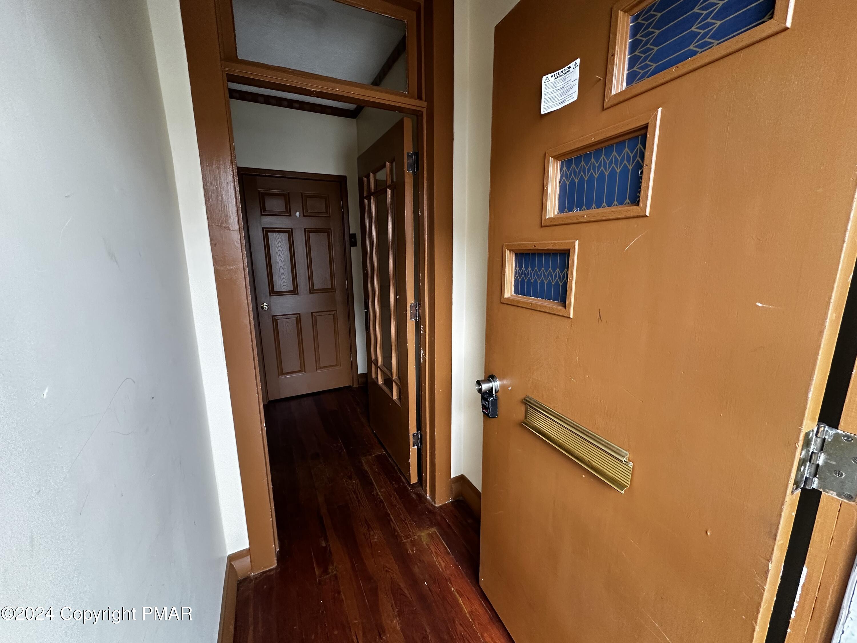 308 South Beech Street Mount Carmel, PA 17851 - Photo 9 of 34 a view of a hallway with wooden floor and staircase