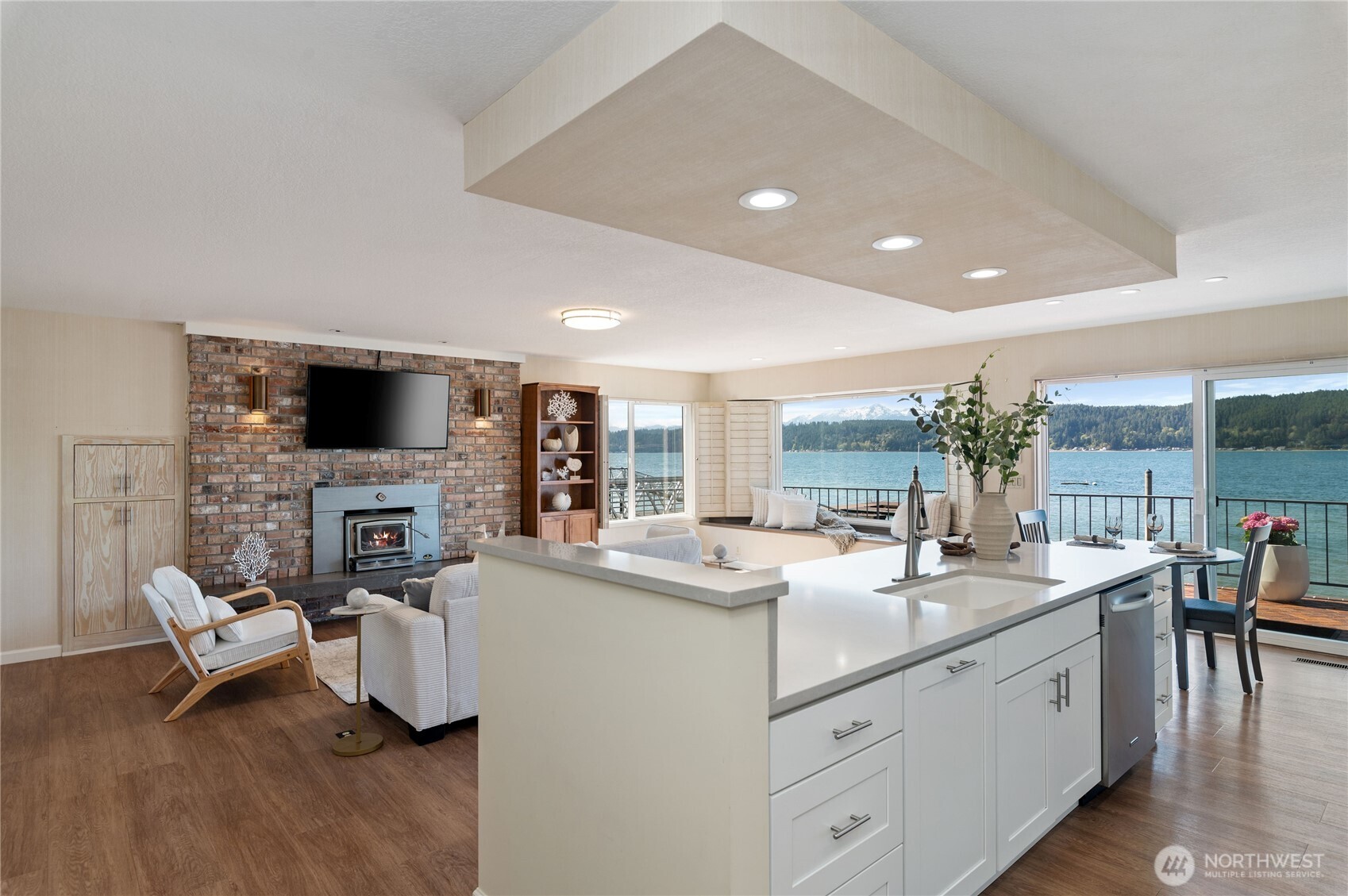 14191 Highway 106 Belfair, WA 98528 - Photo 11 of 40 a large white kitchen with a sink and couch