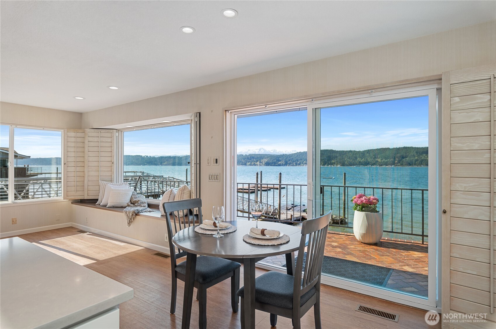 14191 Highway 106 Belfair, WA 98528 - Photo 12 of 40 a living room with furniture and a floor to ceiling window