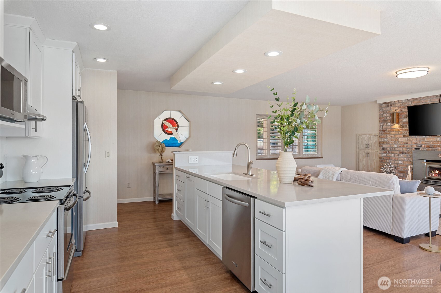 14191 Highway 106 Belfair, WA 98528 - Photo 15 of 40 a kitchen with stainless steel appliances granite countertop a sink and a refrigerator