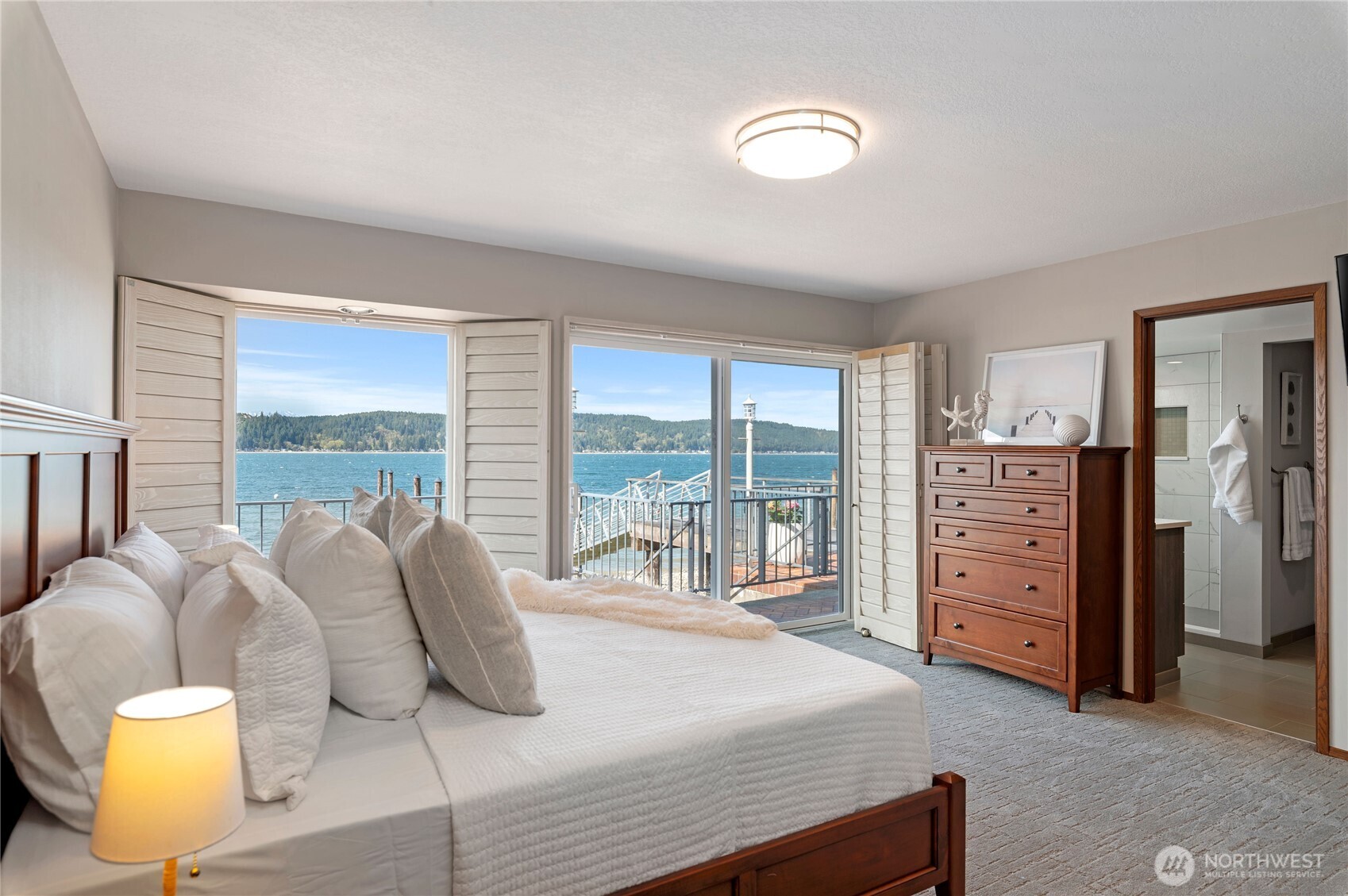 14191 Highway 106 Belfair, WA 98528 - Photo 22 of 40 a bedroom with a bed and walk in closet