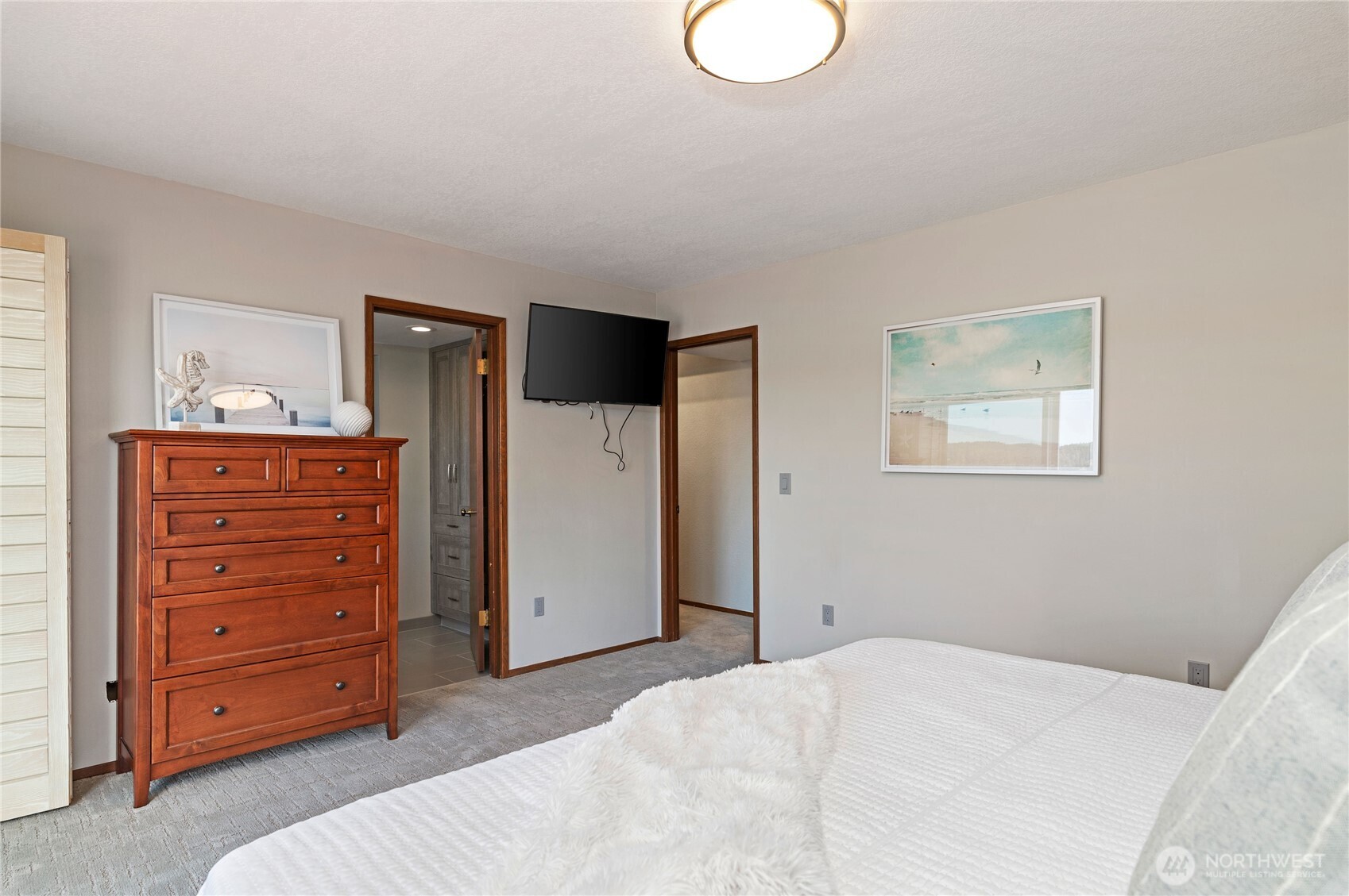 14191 Highway 106 Belfair, WA 98528 - Photo 24 of 40 a bedroom with a bed and furniture