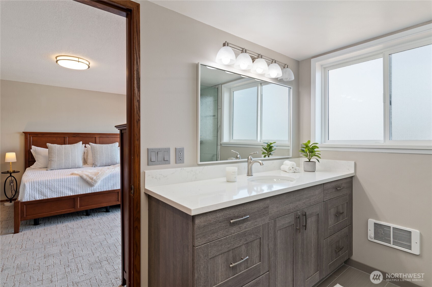 14191 Highway 106 Belfair, WA 98528 - Photo 26 of 40 a en suite bathroom with a double vanity sink and a mirror