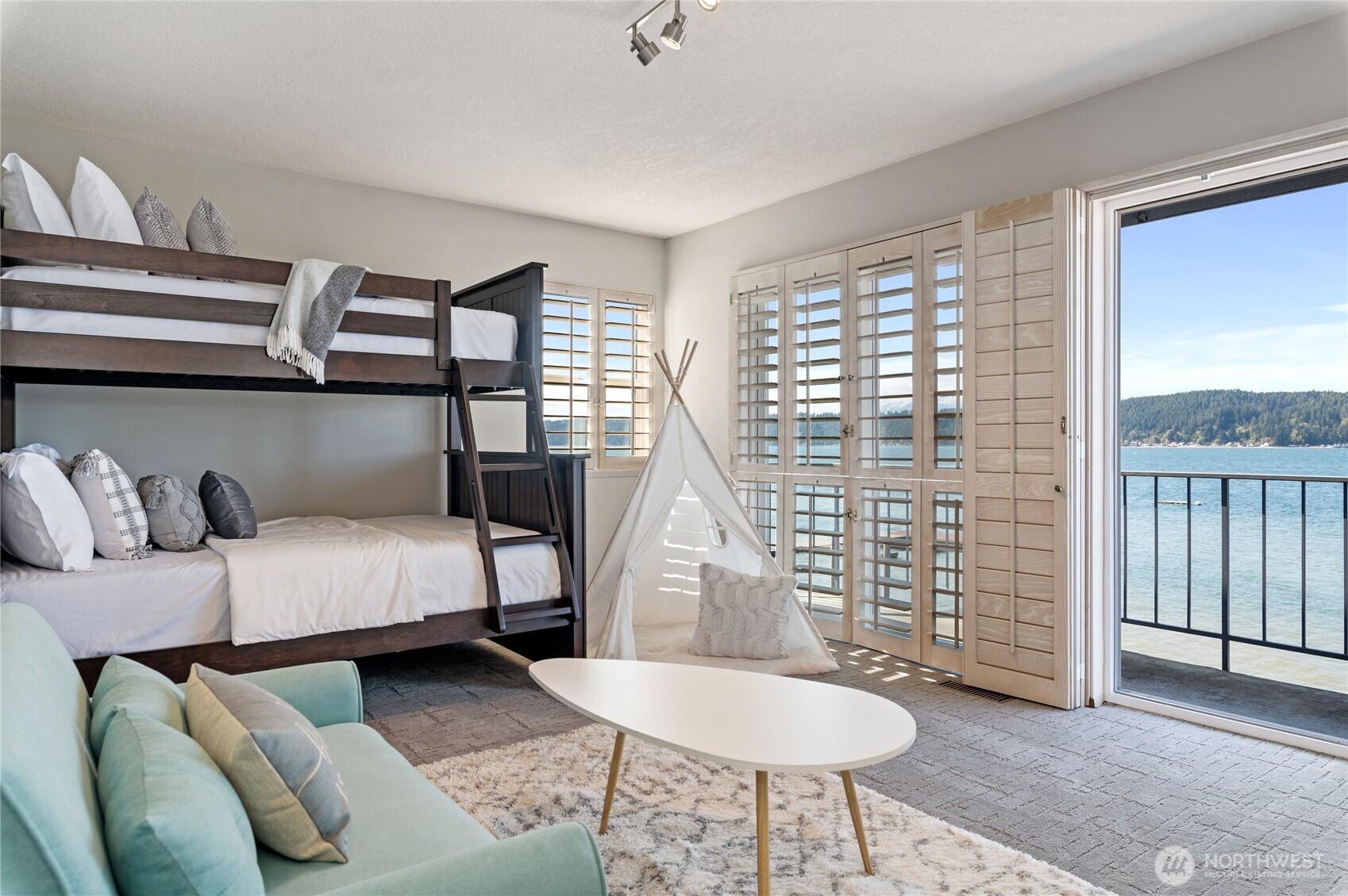 14191 Highway 106 Belfair, WA 98528 - Photo 28 of 40 a bedroom with furniture and a window