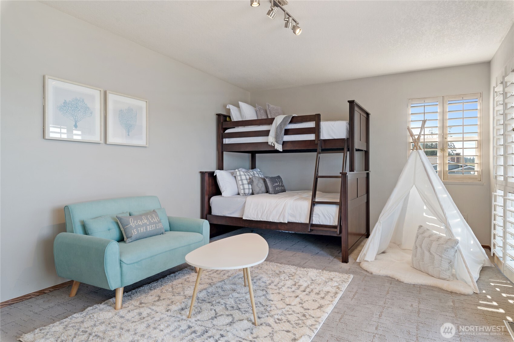 14191 Highway 106 Belfair, WA 98528 - Photo 29 of 40 a living room with furniture and a wooden floor
