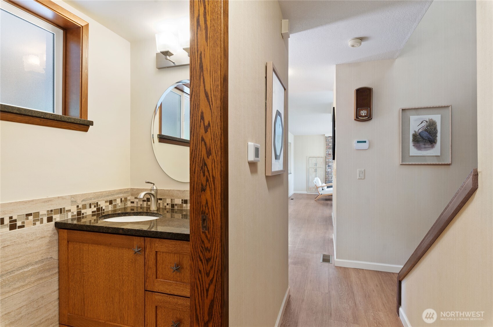 14191 Highway 106 Belfair, WA 98528 - Photo 31 of 40 a bathroom with a granite countertop sink and a mirror