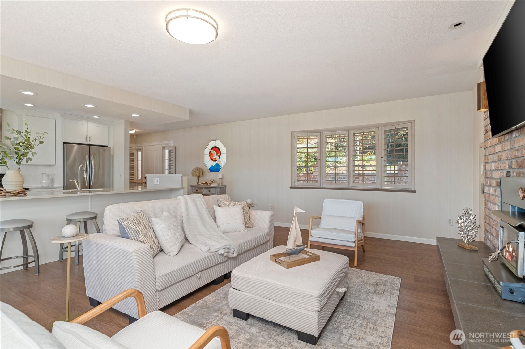 14191 Highway 106 Belfair, WA 98528 - Photo 7 of 40 a living room with furniture and a flat screen tv