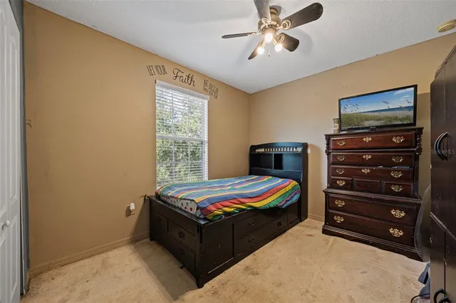 a room with a bed and furniture