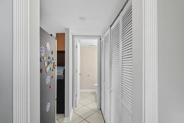 a view of a bathroom from a corridor